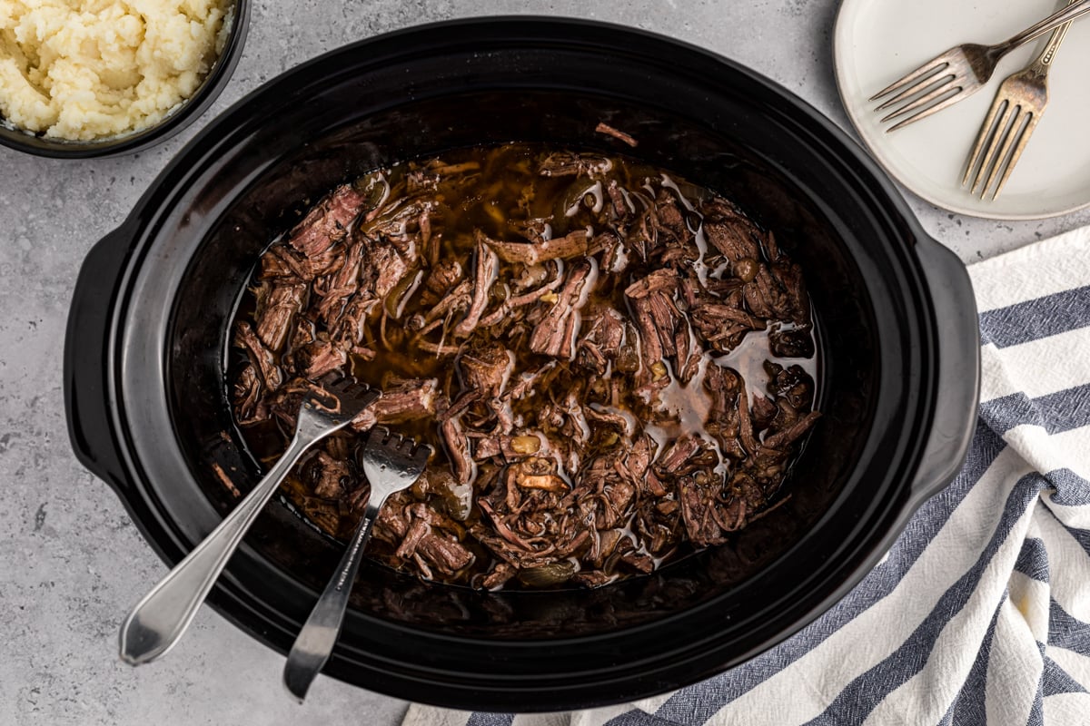 overhead of balsamic beef in a slow cooker.