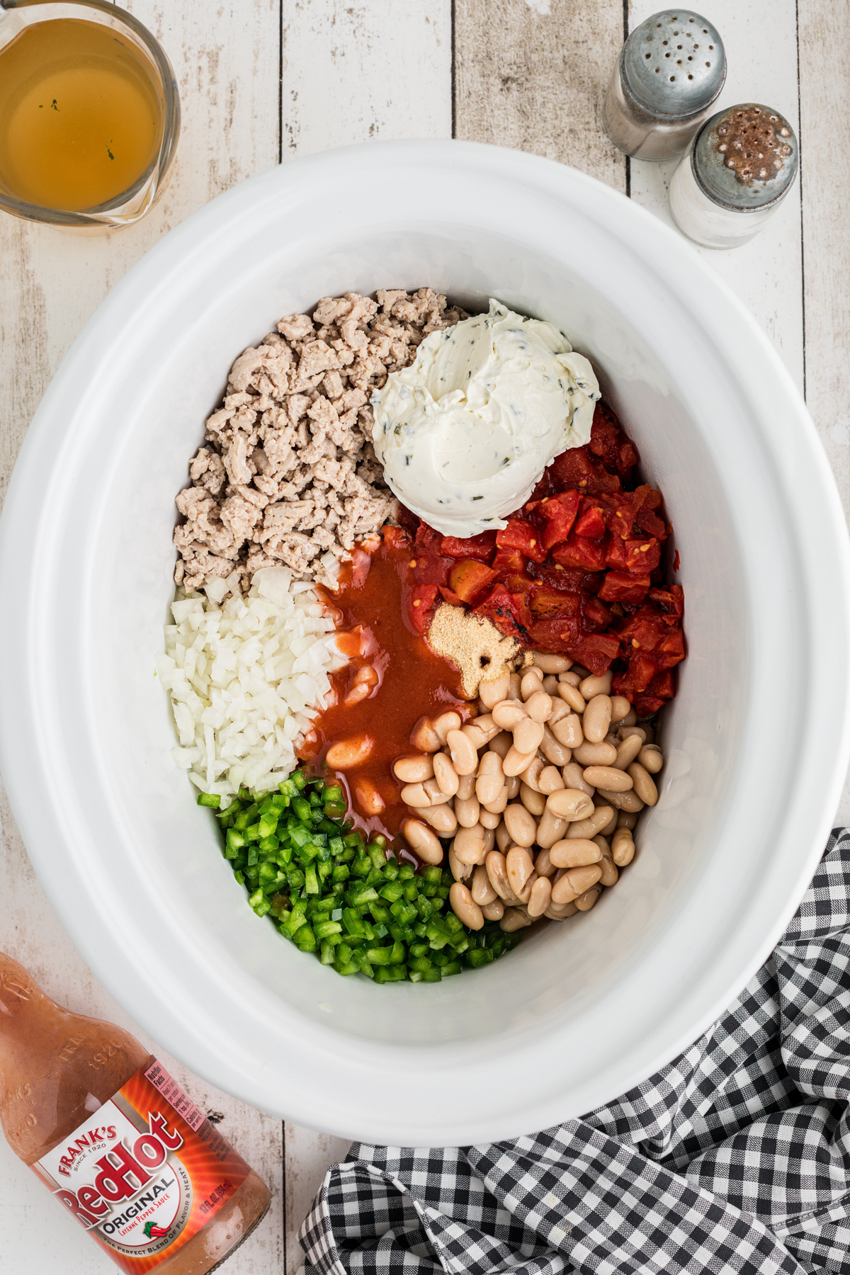 Ingredients for chicken chili in a slow cooker.