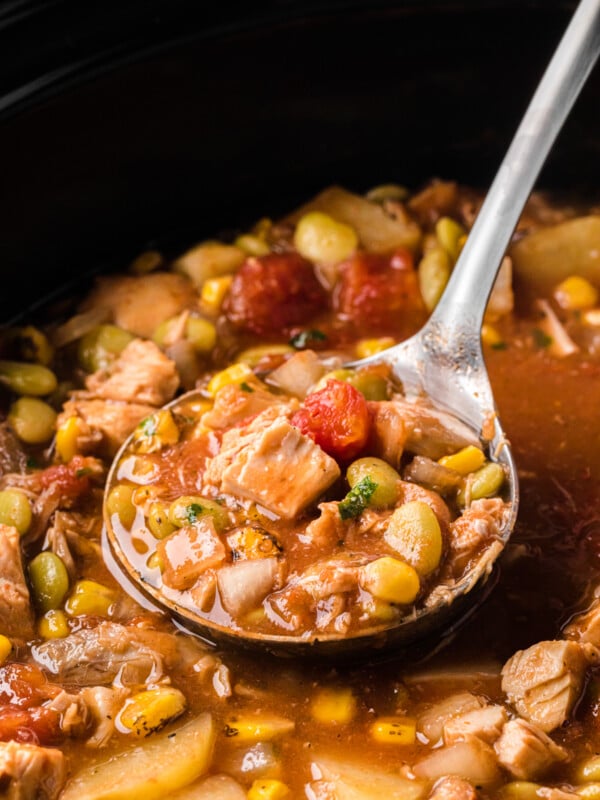 scooping camp stew out of a slow cooker.