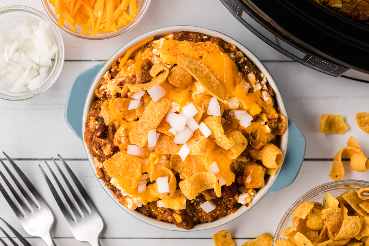 overhead shot of slow cooker chili cheese casserole in a bowl.