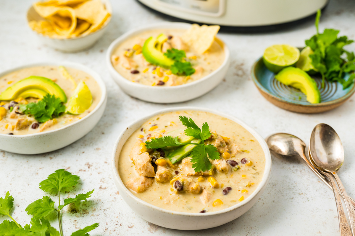 three bowls of slow cooker green enchilada soup.