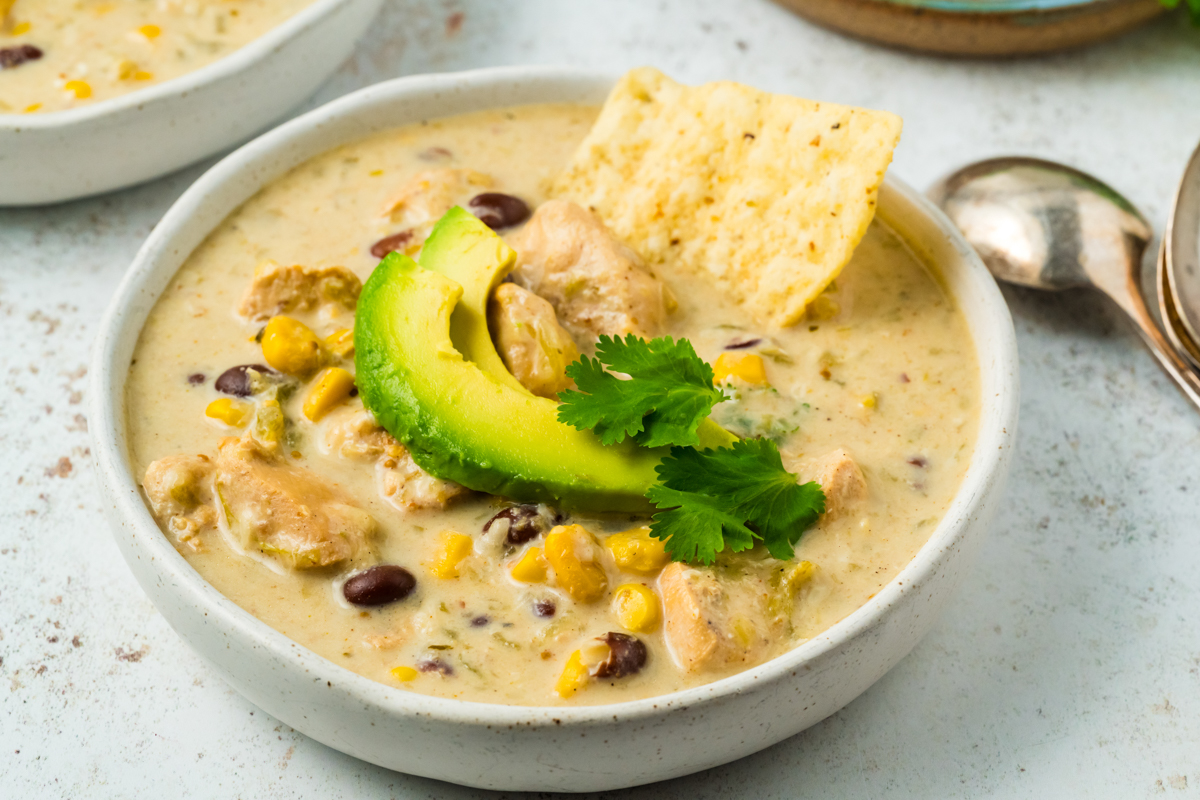 bowl of slow cooker green enchilada soup.