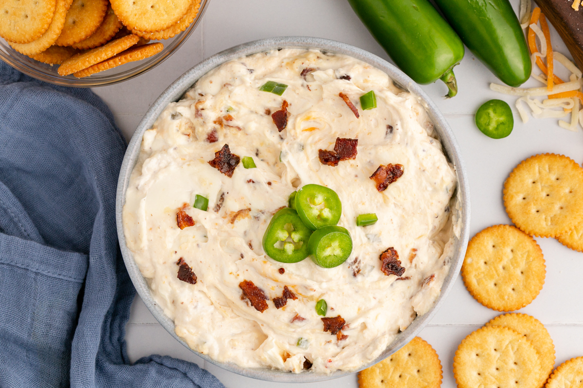 overhead of slow cooker jalapeno popper dip in a serving bowl.