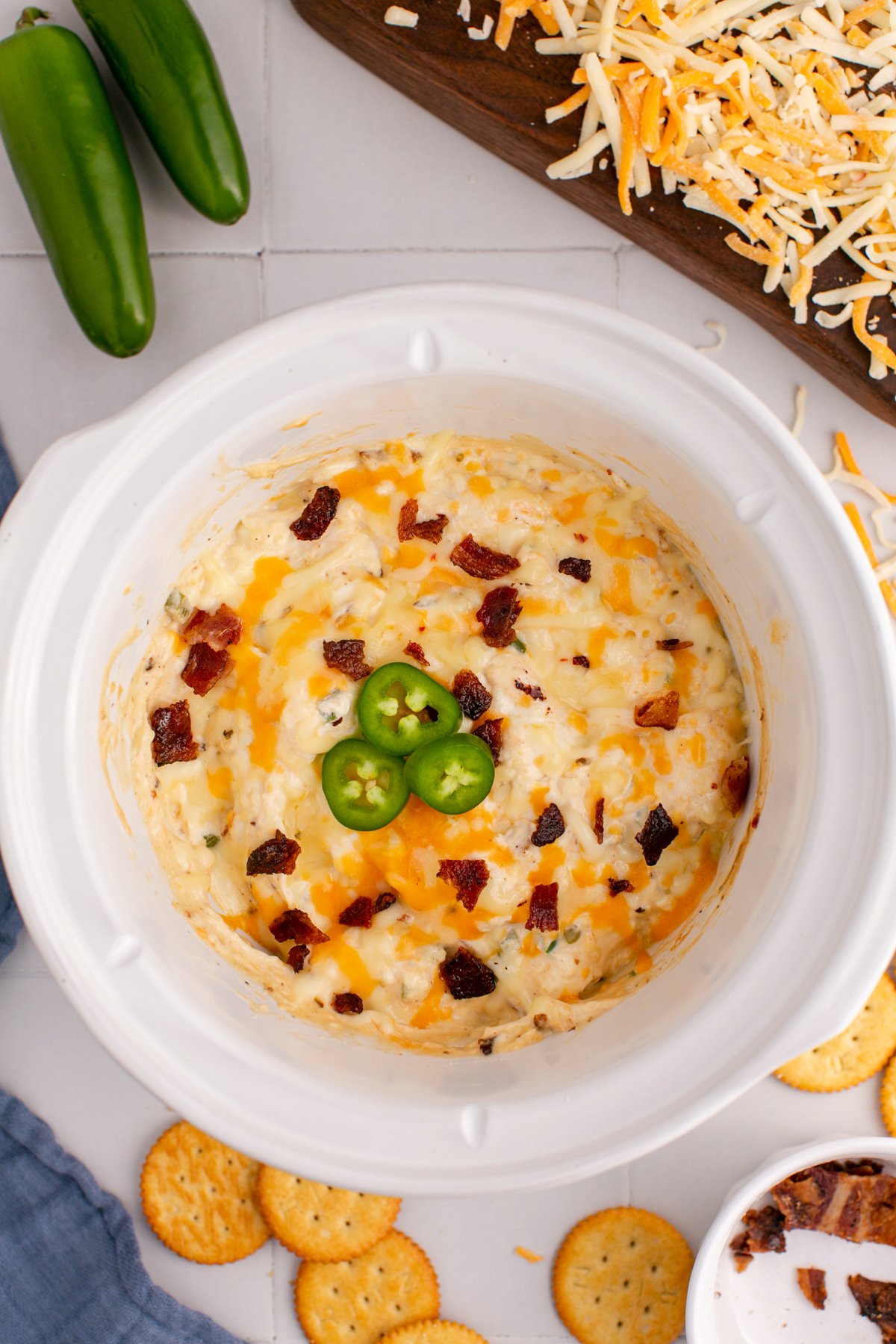 overhead shot of jalapeno popper dip in a slow cooker.
