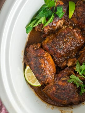 overhead of Jamaican jerk chicken in a slow cooker.