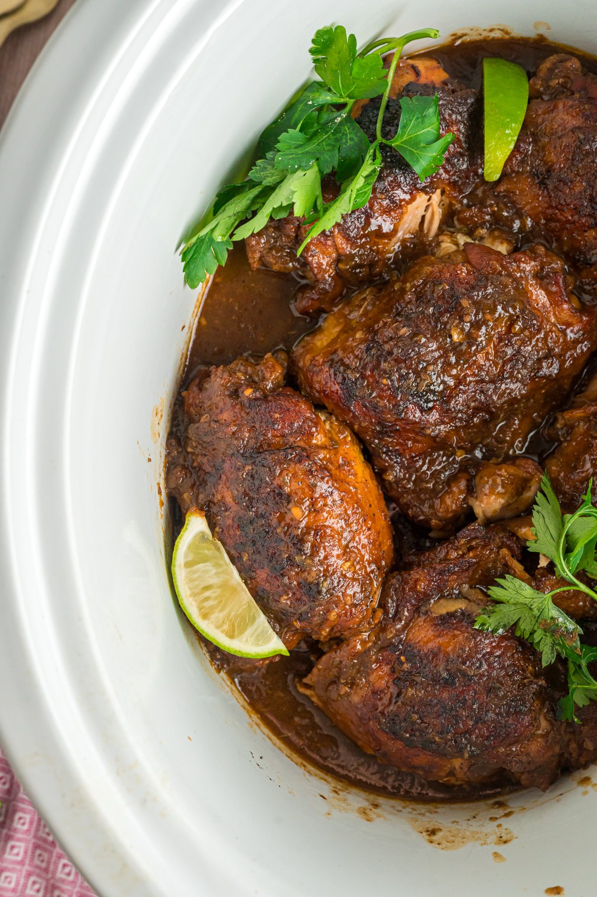 overhead of Jamaican jerk chicken in a slow cooker.