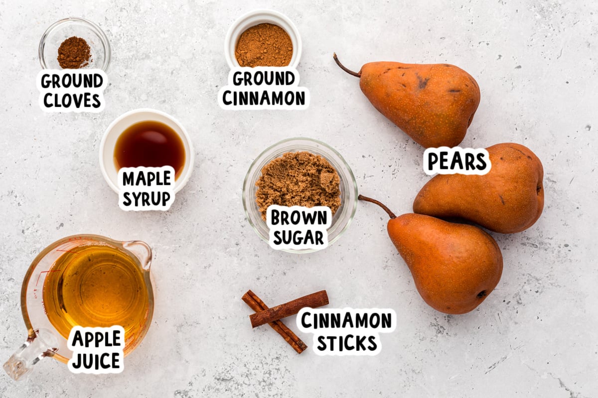 ingredients for slow cooker poached pears on a table.