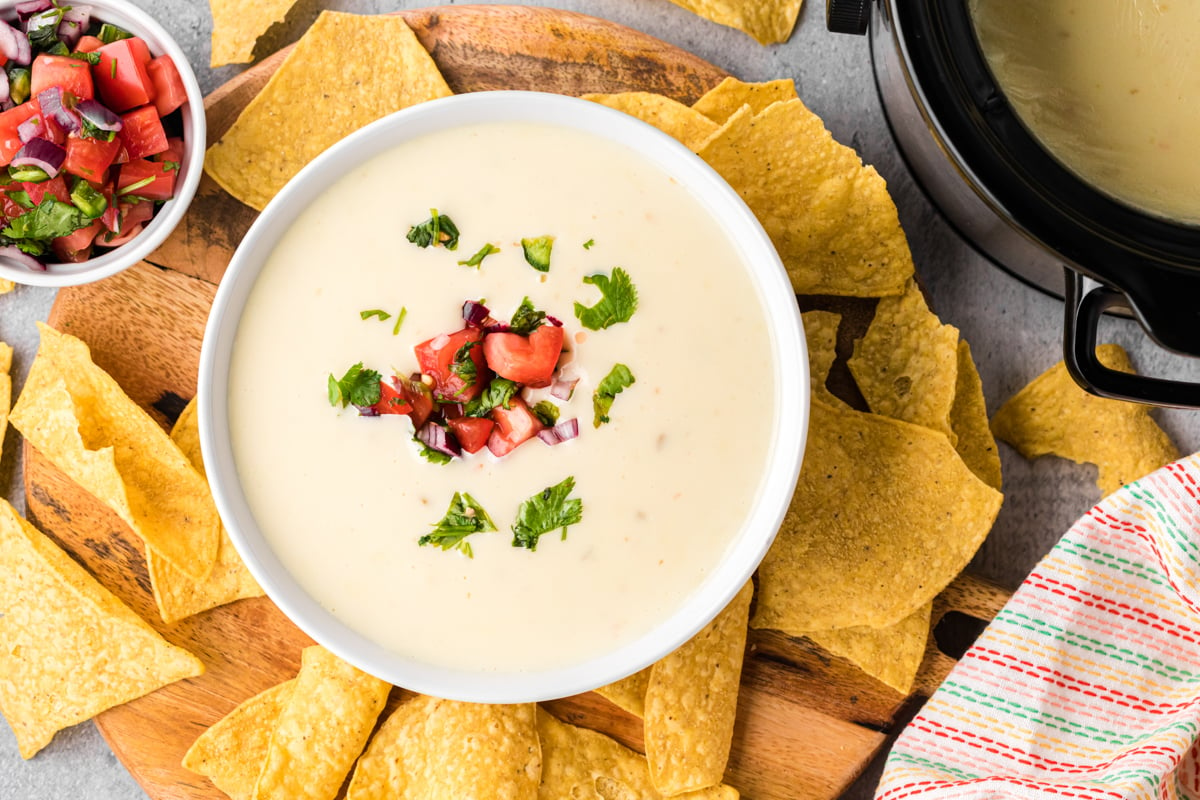 overhead shot of slow cooker restaurant style queso in a bowl.