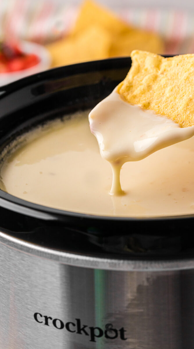 long image of slow cooker restaurant style queso.