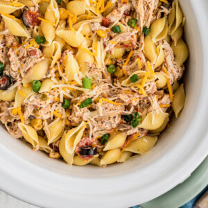 overhead close-up of southwestern cheesy chicken pasta in a slow cooker.