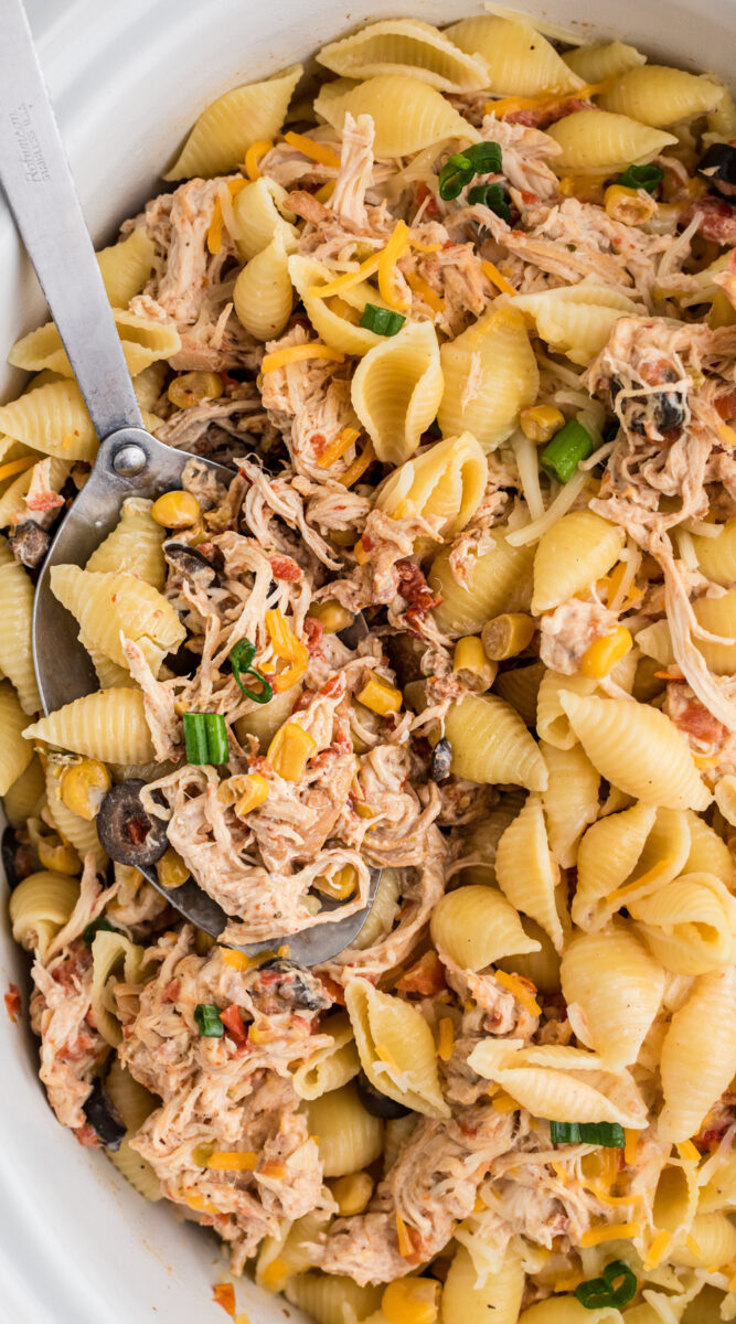 long image of slow cooker southwestern cheesy chicken pasta.