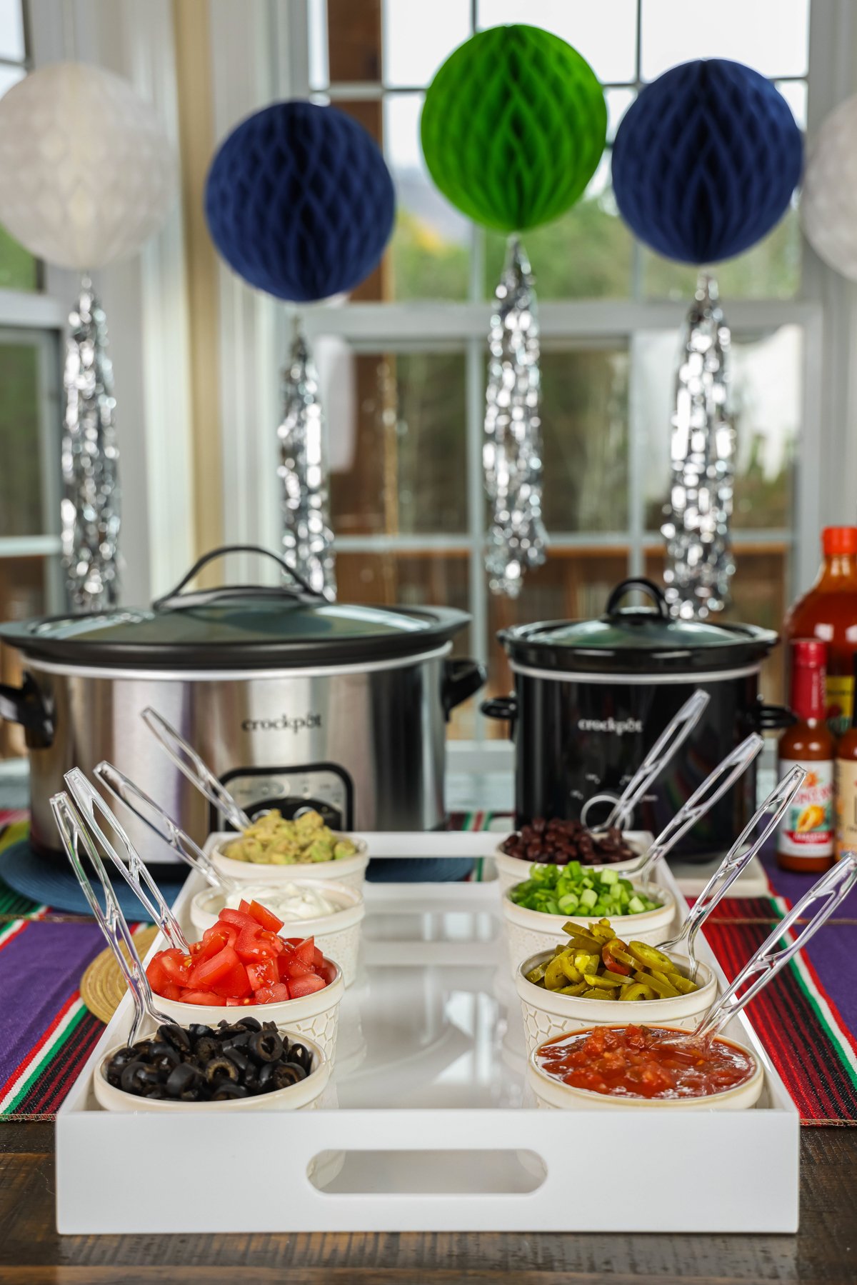 2 crockpots and nacho bar toppings.