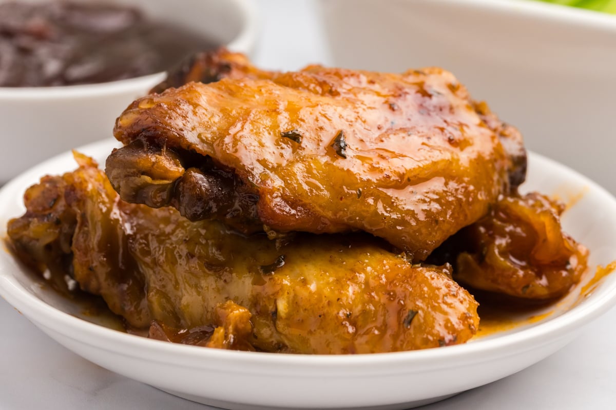 close-up of slow cooker bbq chicken wings on a plate.