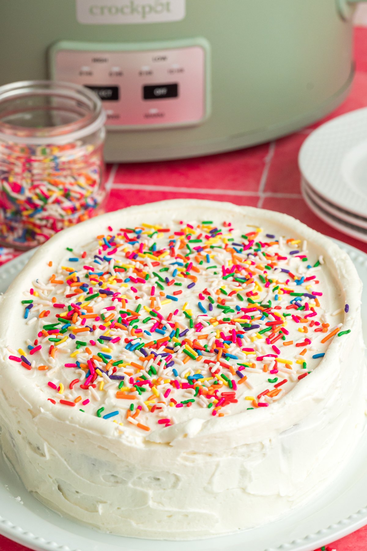 slow cooker birthday cake on a plate.