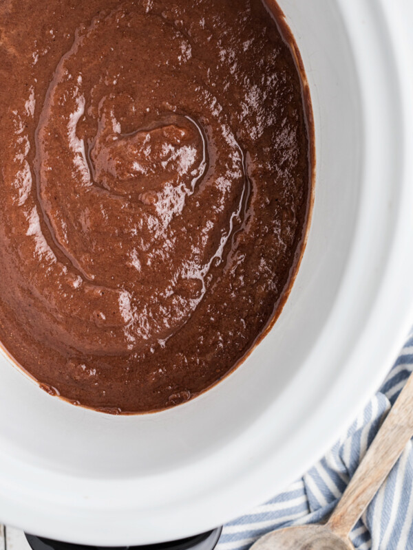 overhead of caramel apple butter in a slow cooker.