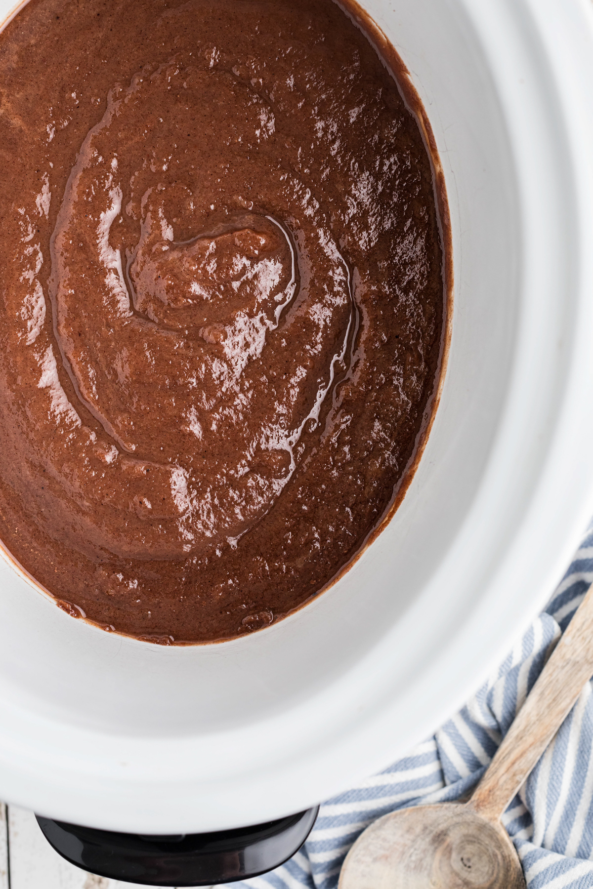 overhead of caramel apple butter in a slow cooker.