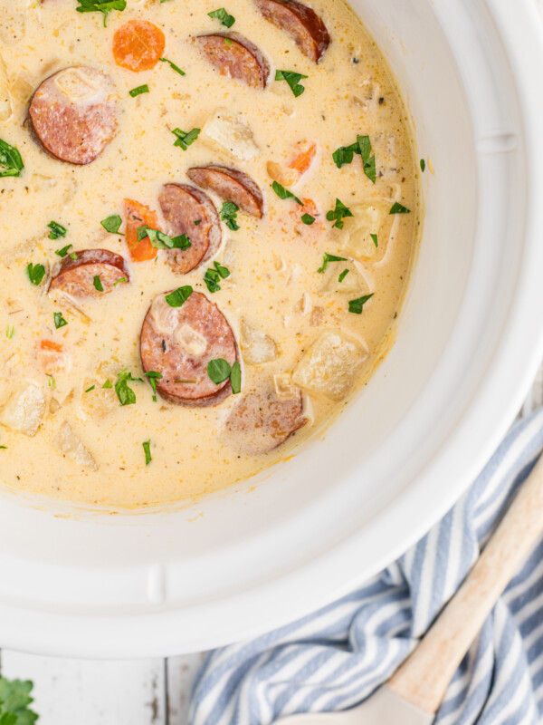 overhead of slow cooker cheesy kielbasa soup.