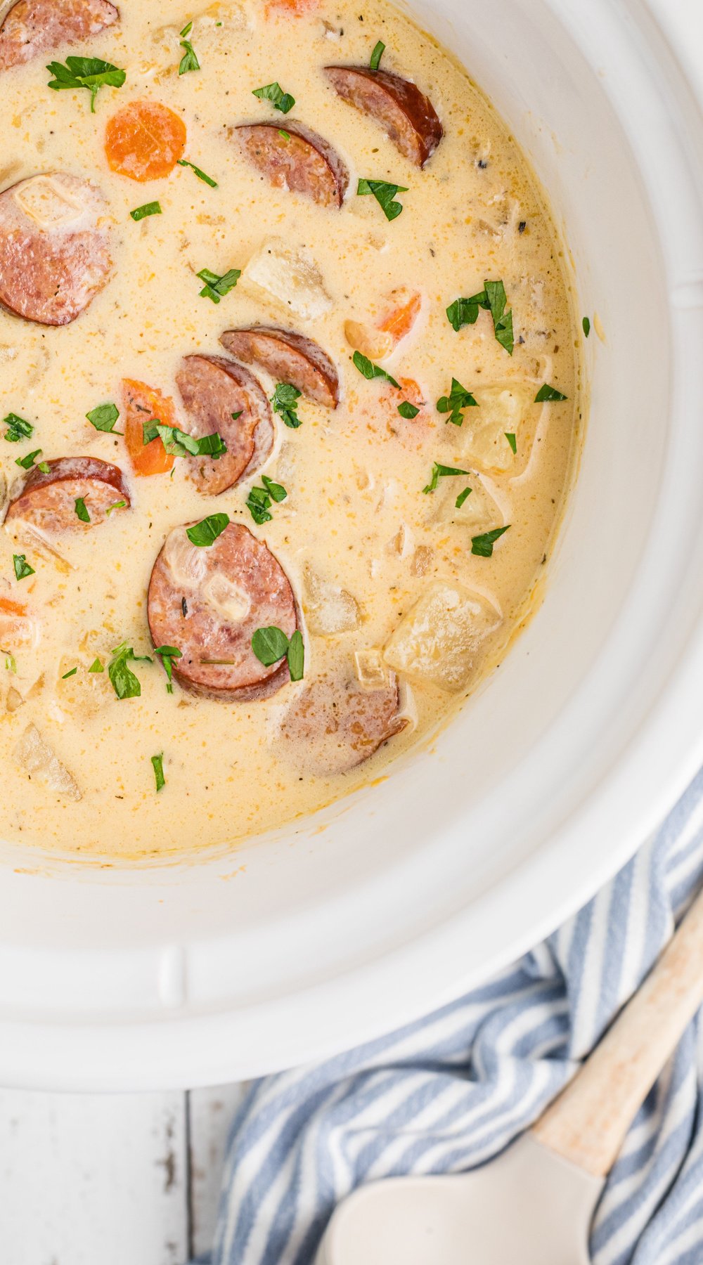 long image of slow cooker cheesy kielbasa soup.