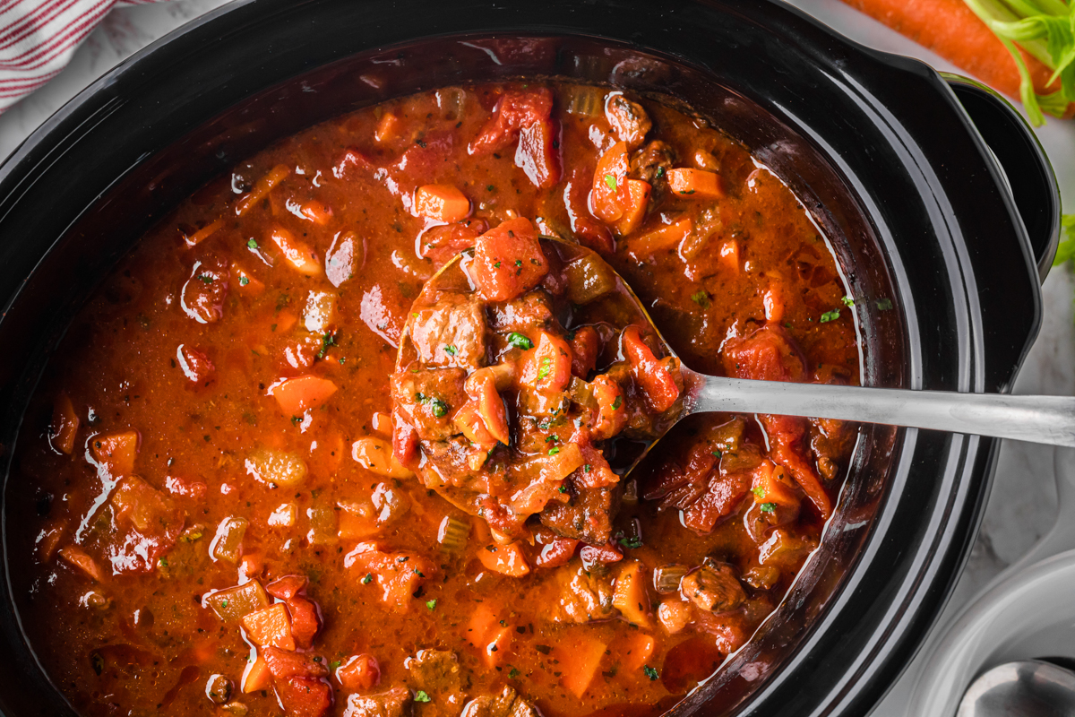 overhead shot of slow cooker hearty italian beef soup.