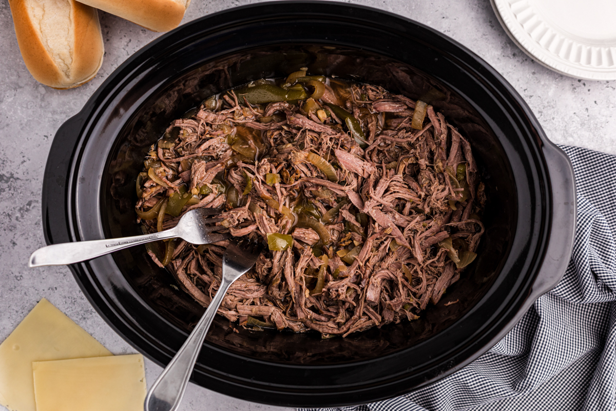 beef for slow cooker philly cheese steaks in a crockpot.