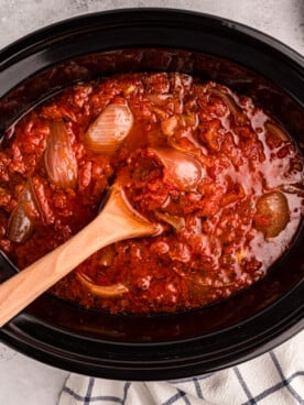 overhead shot of tomato butter sauce in a slow cooker.