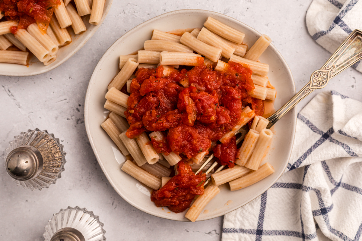 overhead of pasta with slow cooker tomato butter sauce.