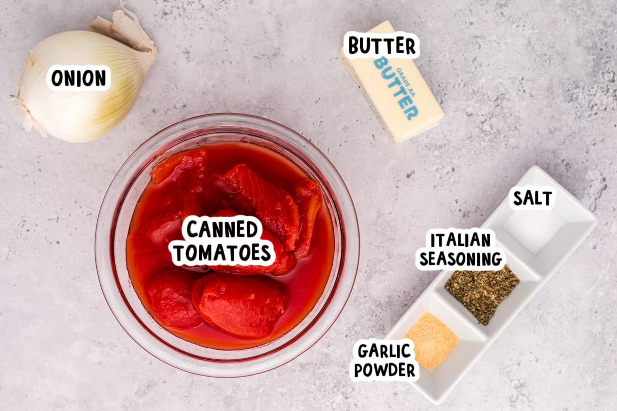 ingredients for slow cooker tomato butter sauce on a table.