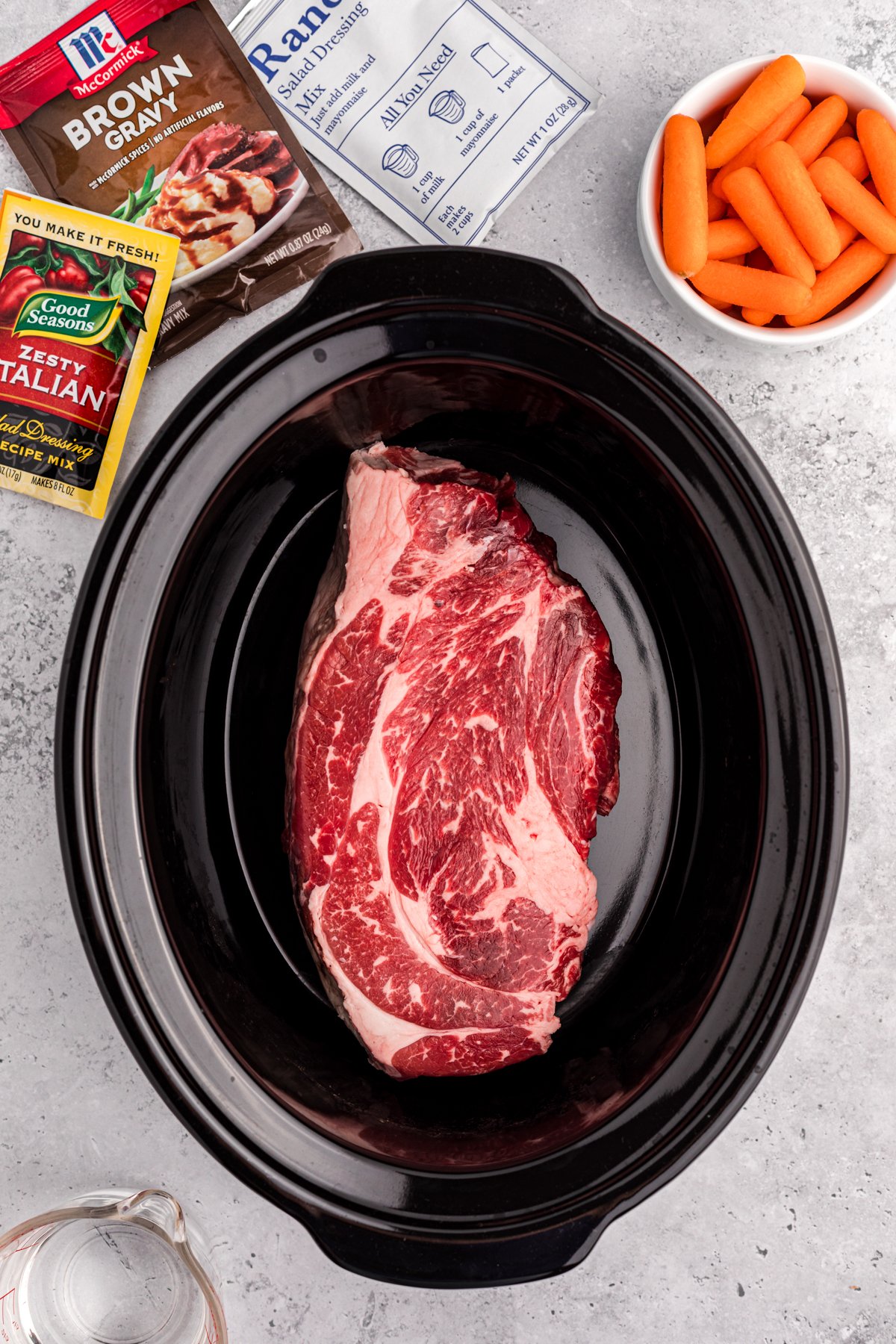 Large chuck roast in a slow cooker.