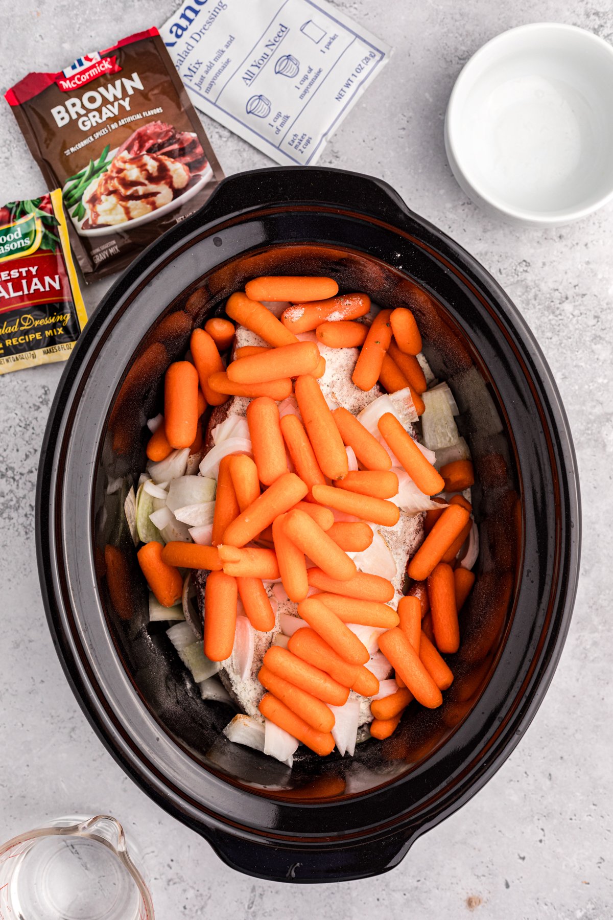 carrots added on top of the pot roast and packets.