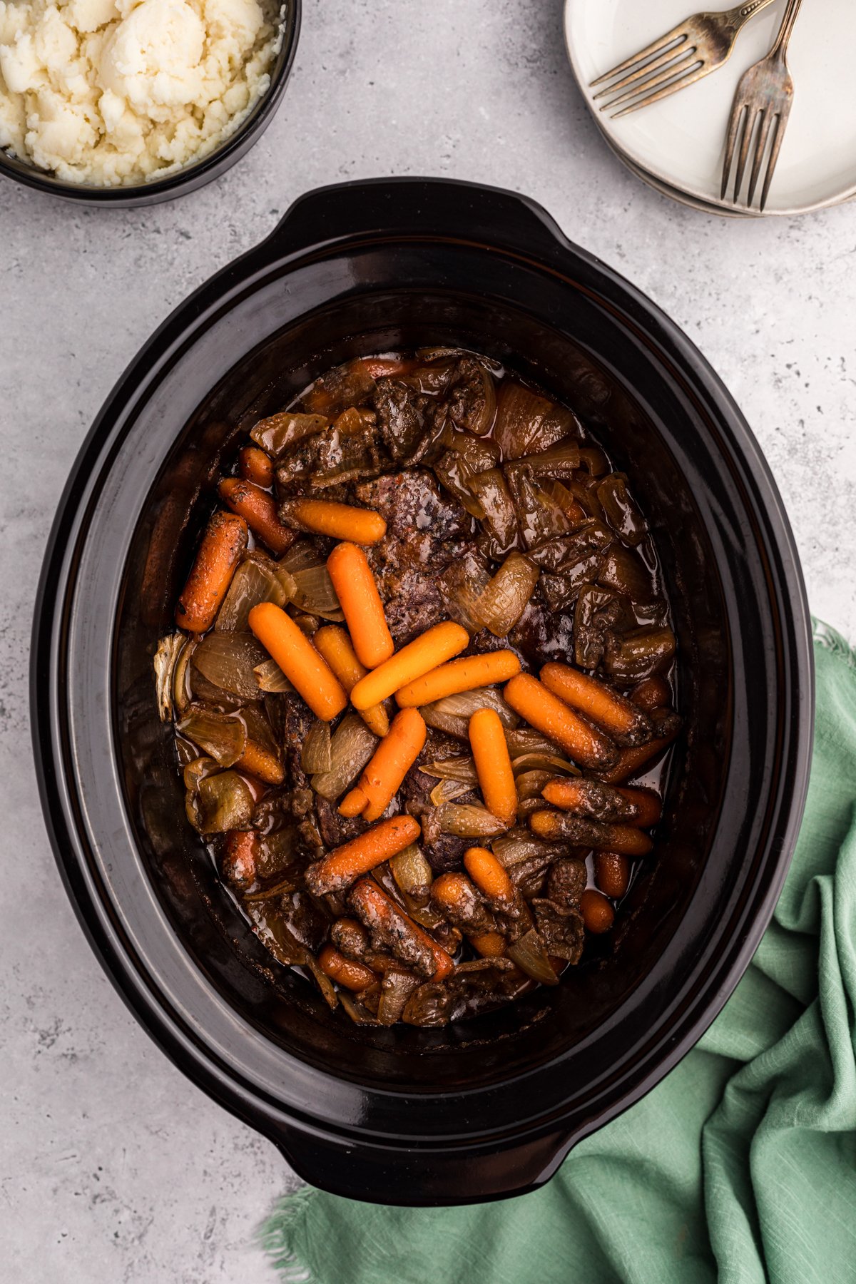 cooked pot roast and carorots.