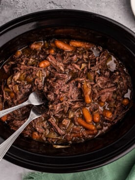 overhead of 3 packet roast in a slow cooker.