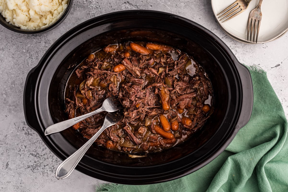overhead of 3 packet roast in a slow cooker.