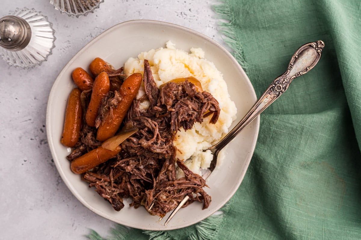 overhead shot of serving of slow cooker 3 packet roast on a plate.