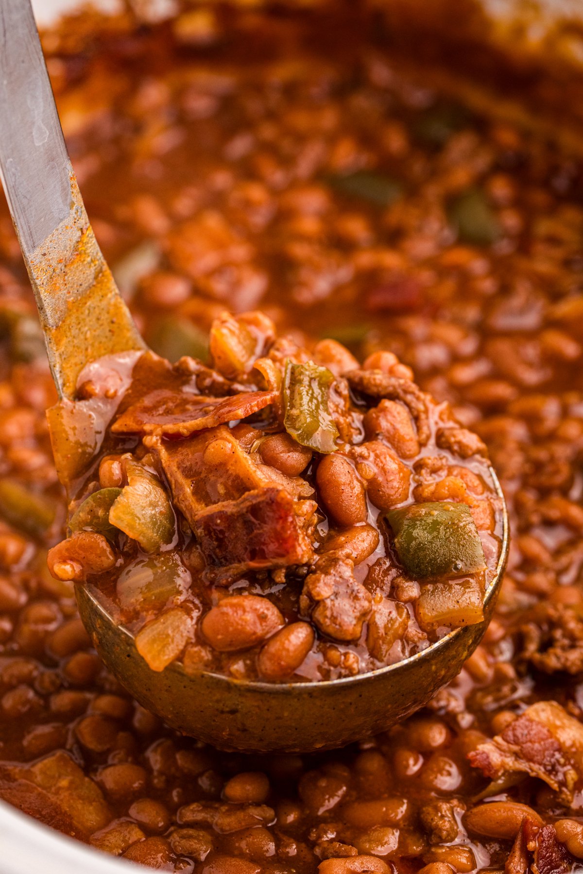 scooping out slow cooker land your man baked beans.