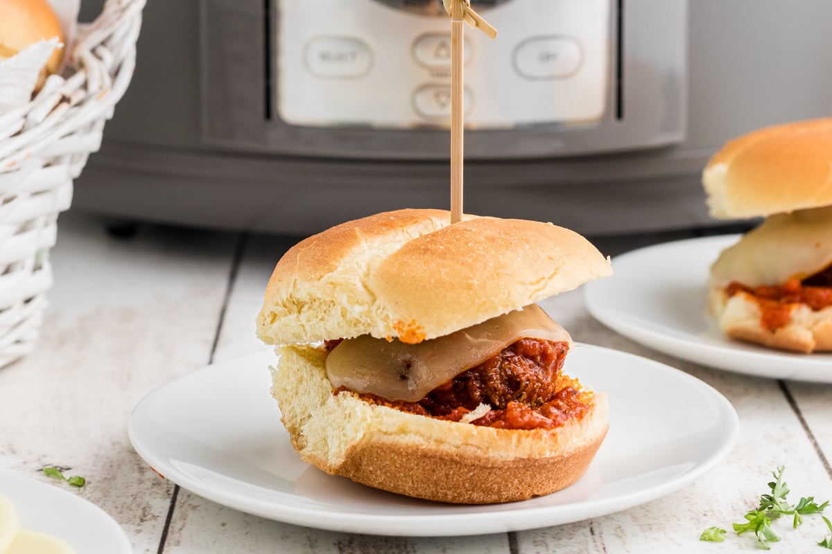 serving of slow cooker meatball sliders on a plate.