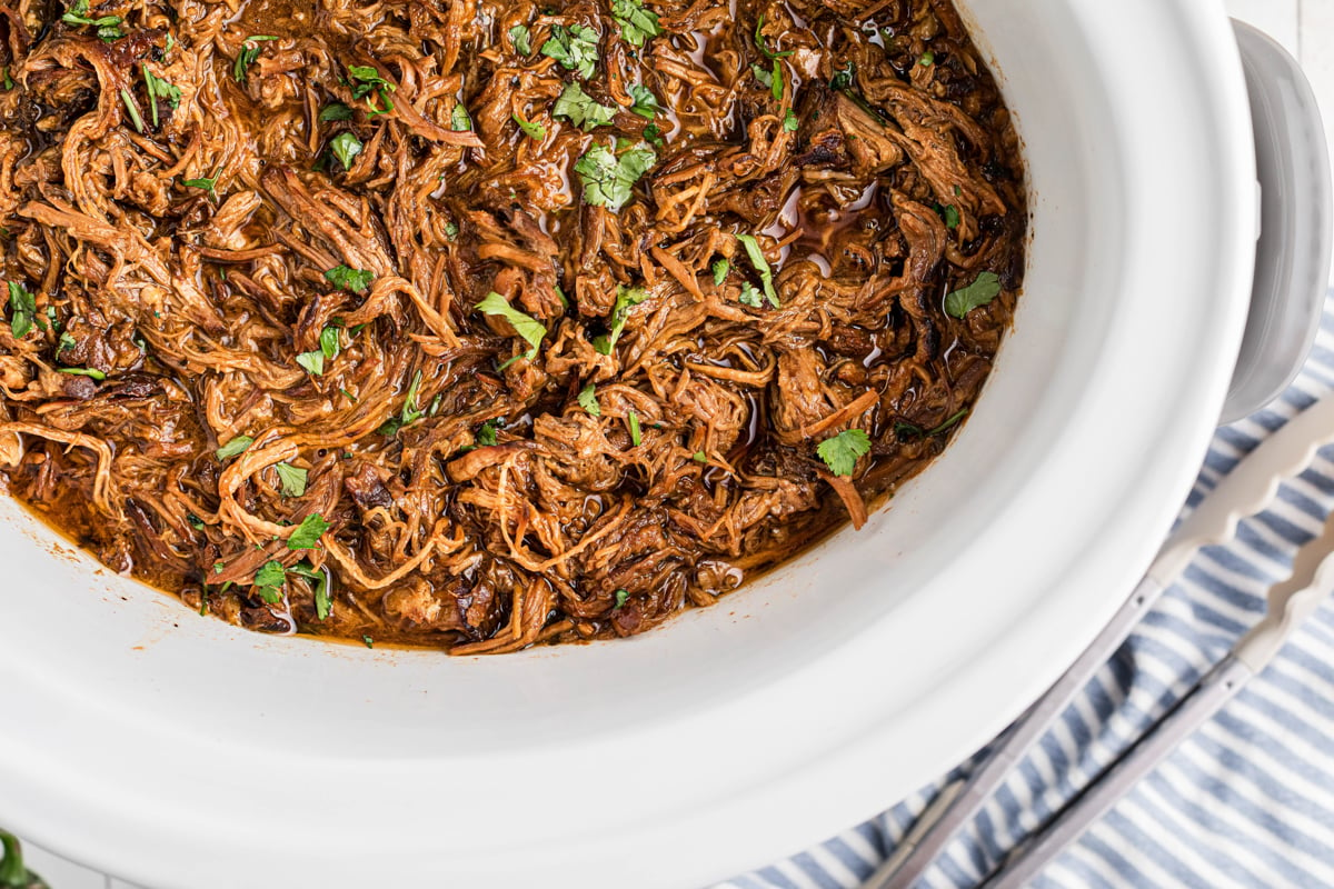 overhead shot of slow cooker pulled pork chow down.