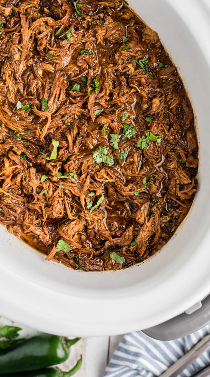 long image of slow cooker pulled pork chow down.