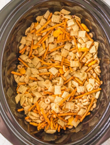 overhead shot of ranch chex mix in a slow cooker.