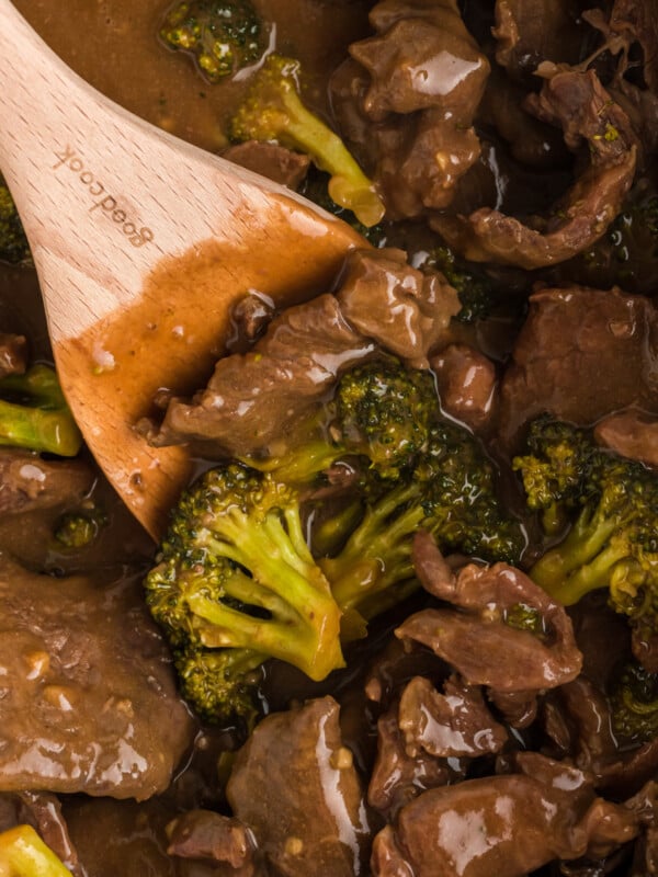 scooping out slow cooker beef and broccoli.