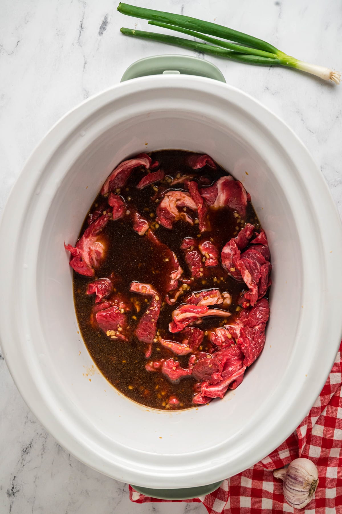 beef with homemade asain sauce in slow cooker.