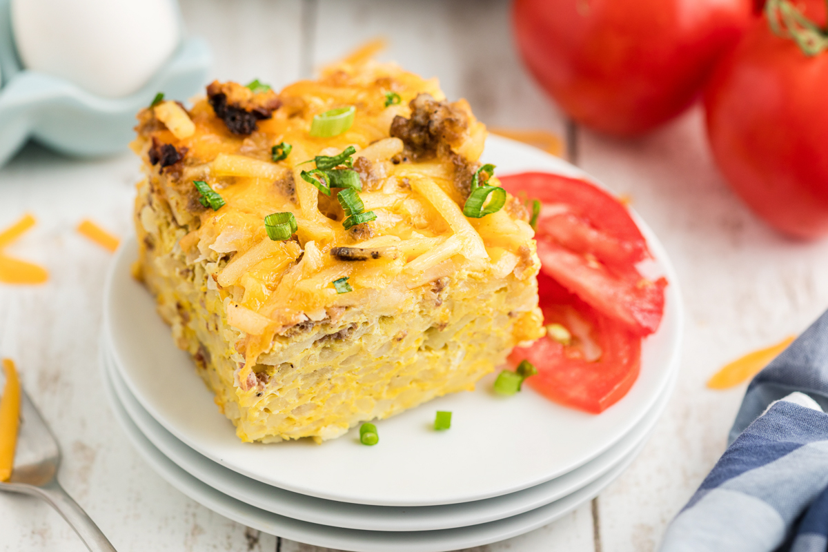 serving of slow cooker breakfast casserole on a stack of plates.