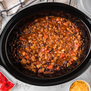 overhead shot of frito pie cooking in a crockpot.