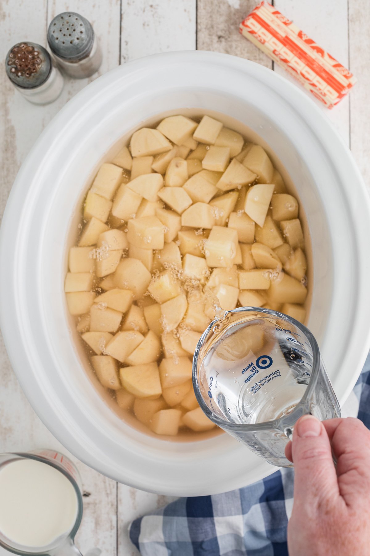potaoes and water in a slow cooker.