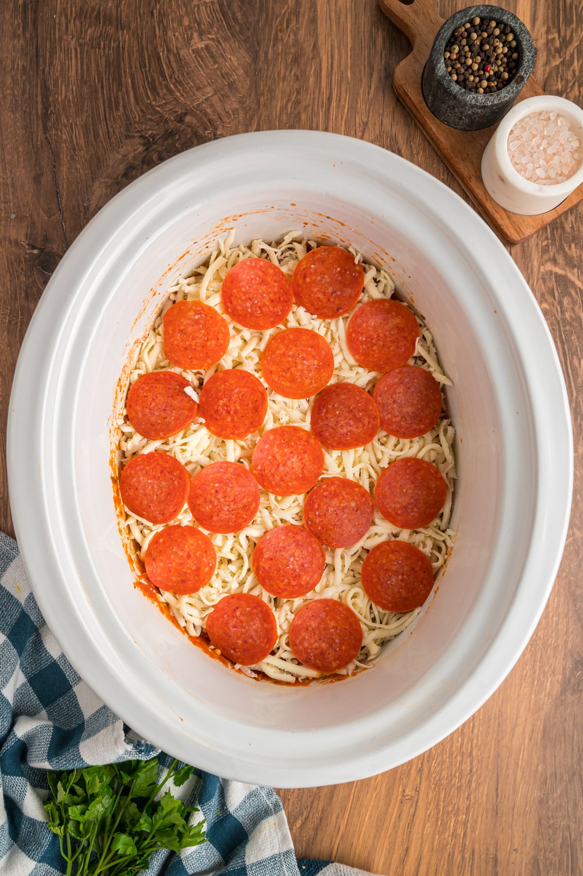 mozzarella cheese and pepperoni on top of the chicken.