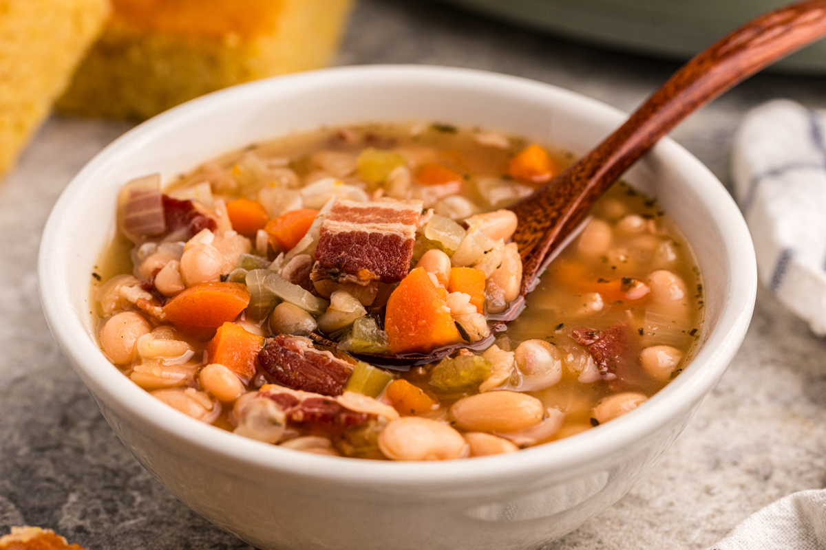 close-up of a bowl of slow cooker beer and bacon bean soup.