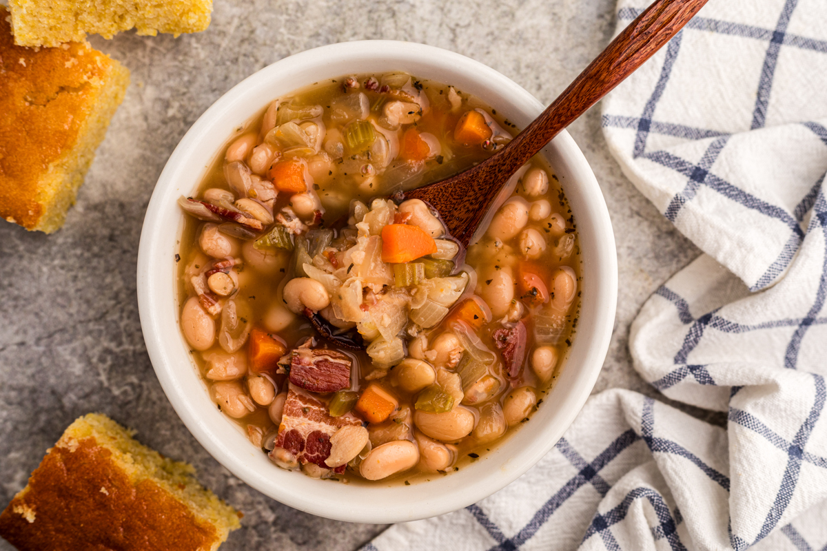overhead shot of a bowl of slow cooker beer and bacon bean soup.