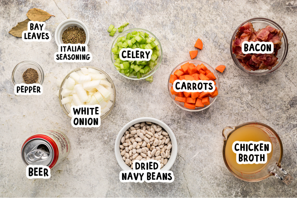 ingredients for slow cooker beer and bacon bean soup on a table.