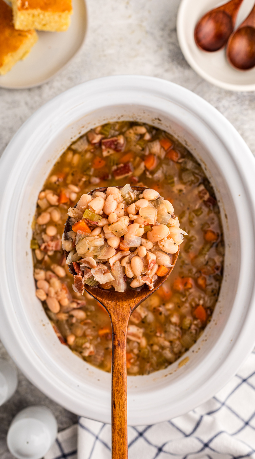long image of slow cooker beer and bacon bean soup.