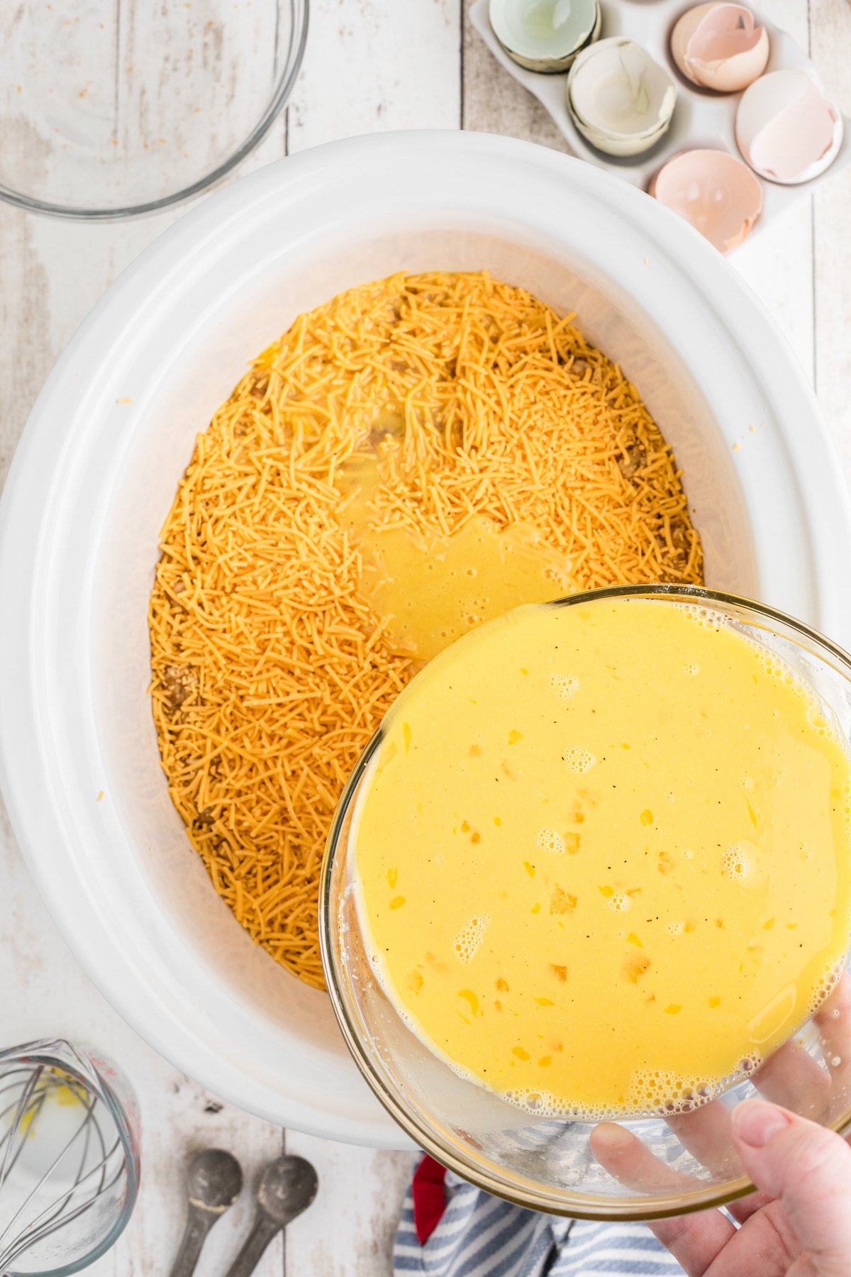 egg mixture being poured over.