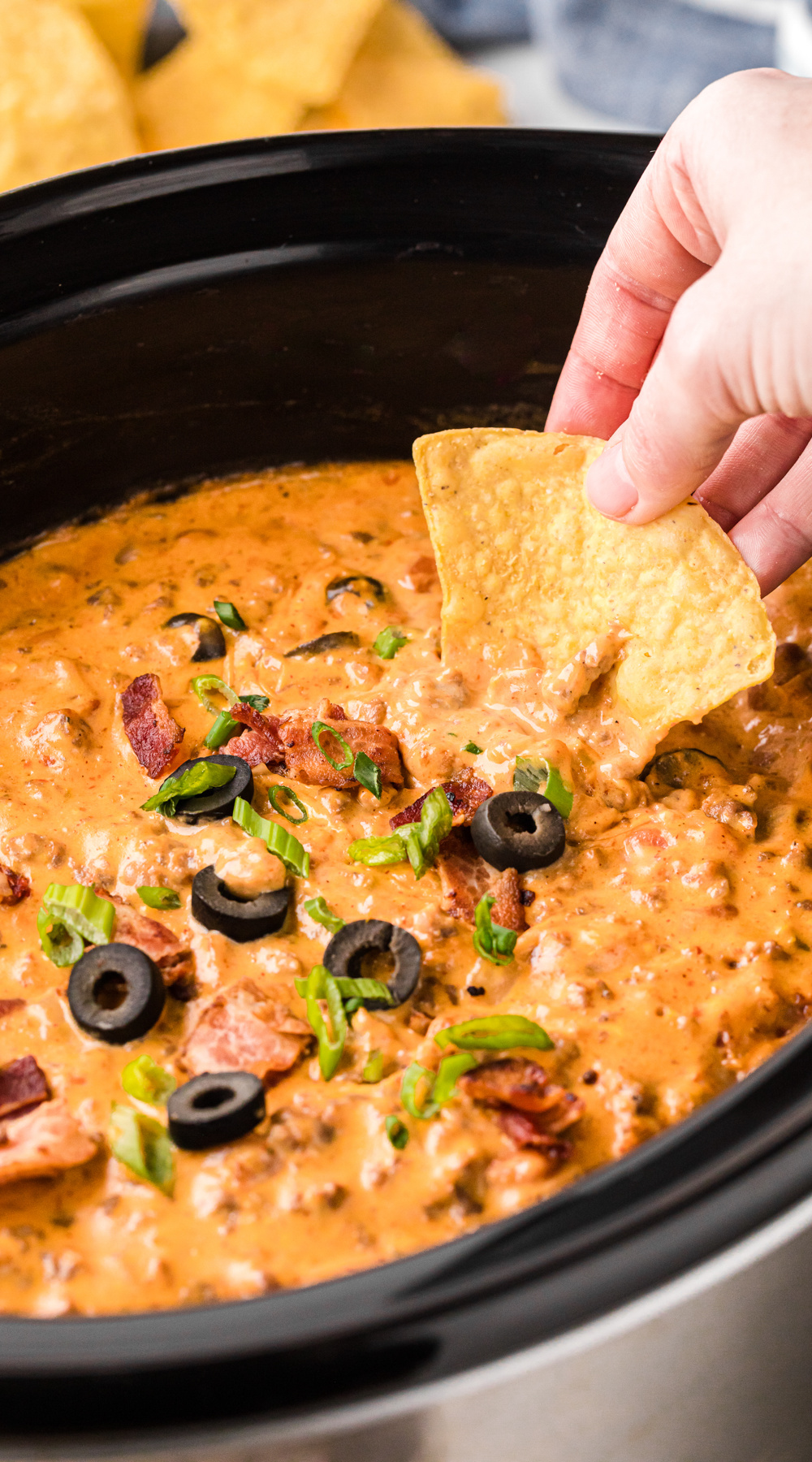 long image of slow cooker loaded nacho dip.